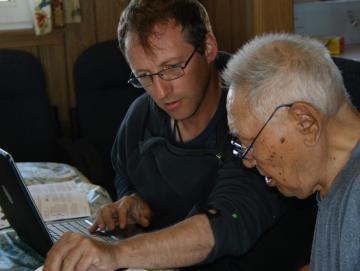 Aaron Fox working through Boulton recordings with the late Iñupiaq elder and music expert Warren Matumeak